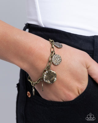 Winking Wild - Brass - Hammered Disc White Rhinestone Paparazzi Lobster Claw Bracelet