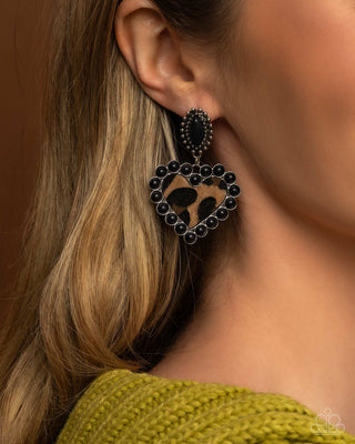 Whimsical Wrangler - Black - Sandstone Fuzzy Cow-Print Heart Paparazzi Post Earrings